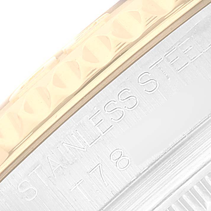 This close-up image shows the engraved edge of the bezel and part of the casing of a Rolex Yacht-Master 68623 Men
s Steel and Gold (two tone) Blue Dial 68623 Men
s Steel and Gold (two tone) Blue Dial watch.