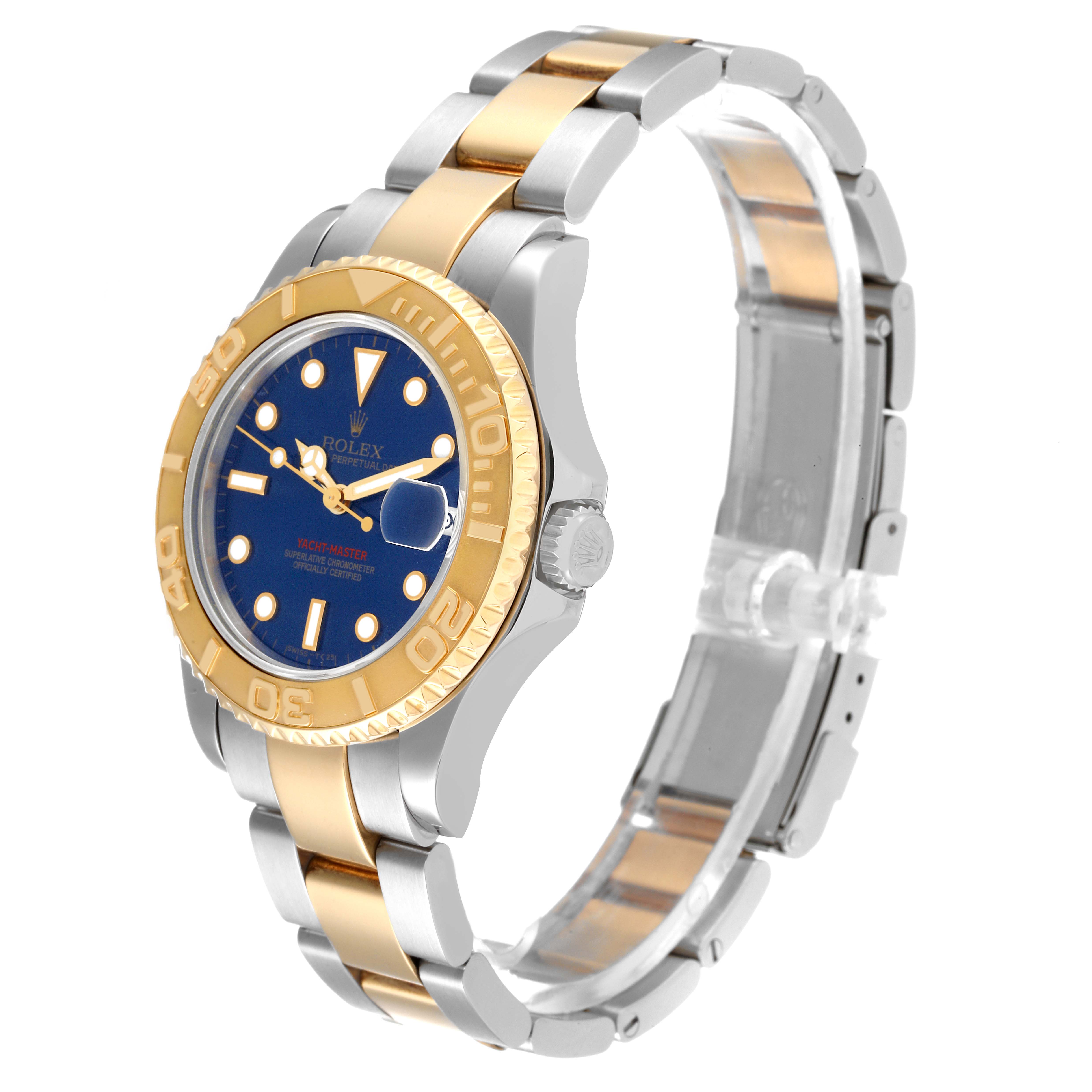 The Rolex Yacht-Master 68623 Men
s Steel and Gold (two tone) Blue Dial 68623 Men
s Steel and Gold (two tone) Blue Dial watch is shown at a three-quarter angle, highlighting the face, bezel, crown, and bracelet.