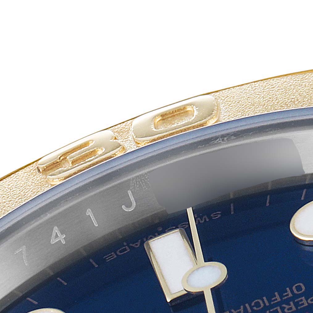 The image shows a close-up of the bezel and part of the dial of a Rolex Yacht-Master 16623 Men's Steel and Gold (two tone) Blue Dial 16623 Men's Steel and Gold (two tone) Blue Dial watch.