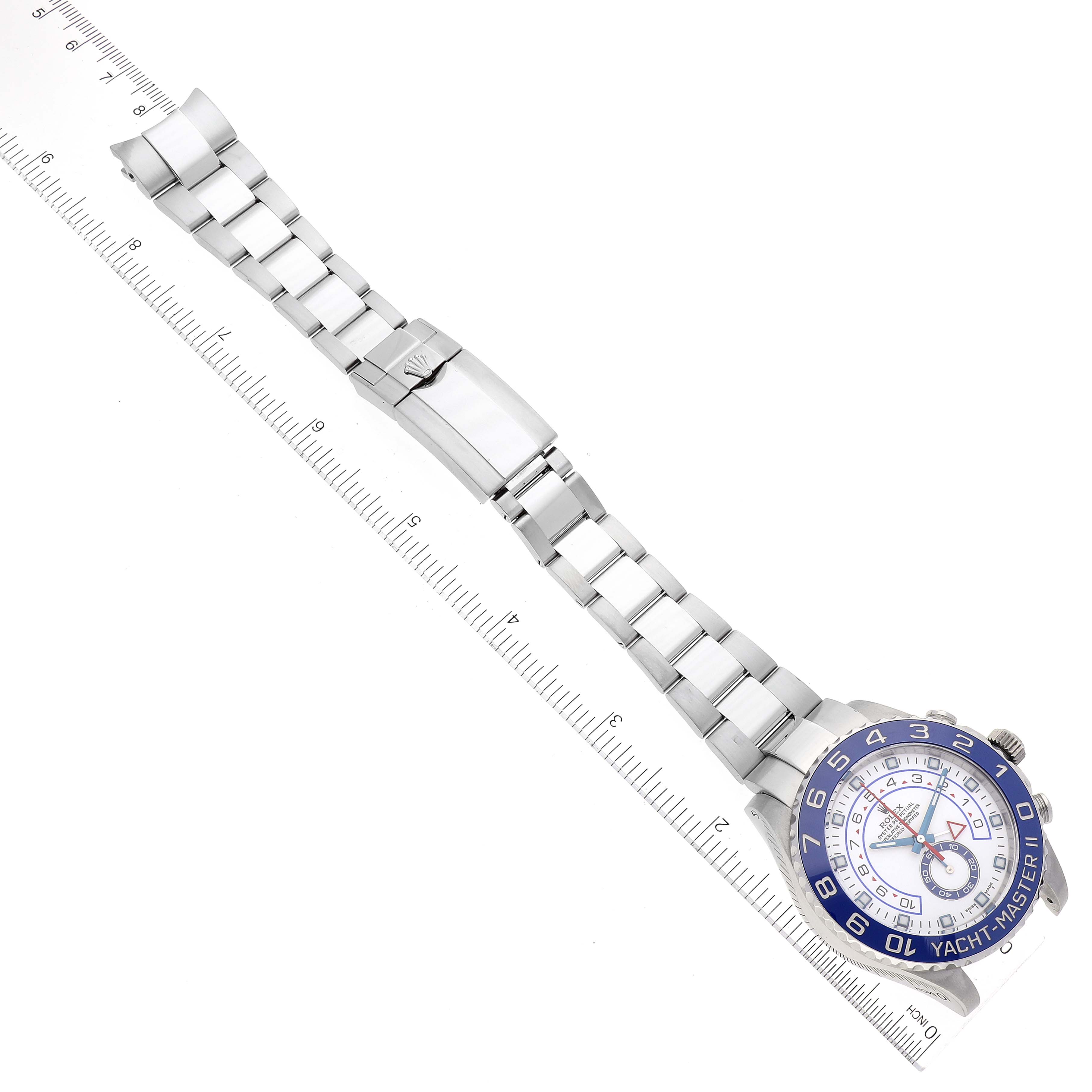 The image shows the Rolex Yacht-Master 116680 Men
s Stainless Steel White Dial 116680 Men
s Stainless Steel White Dial watch laid flat, highlighting the watch face and stainless steel bracelet with ruler for scale.