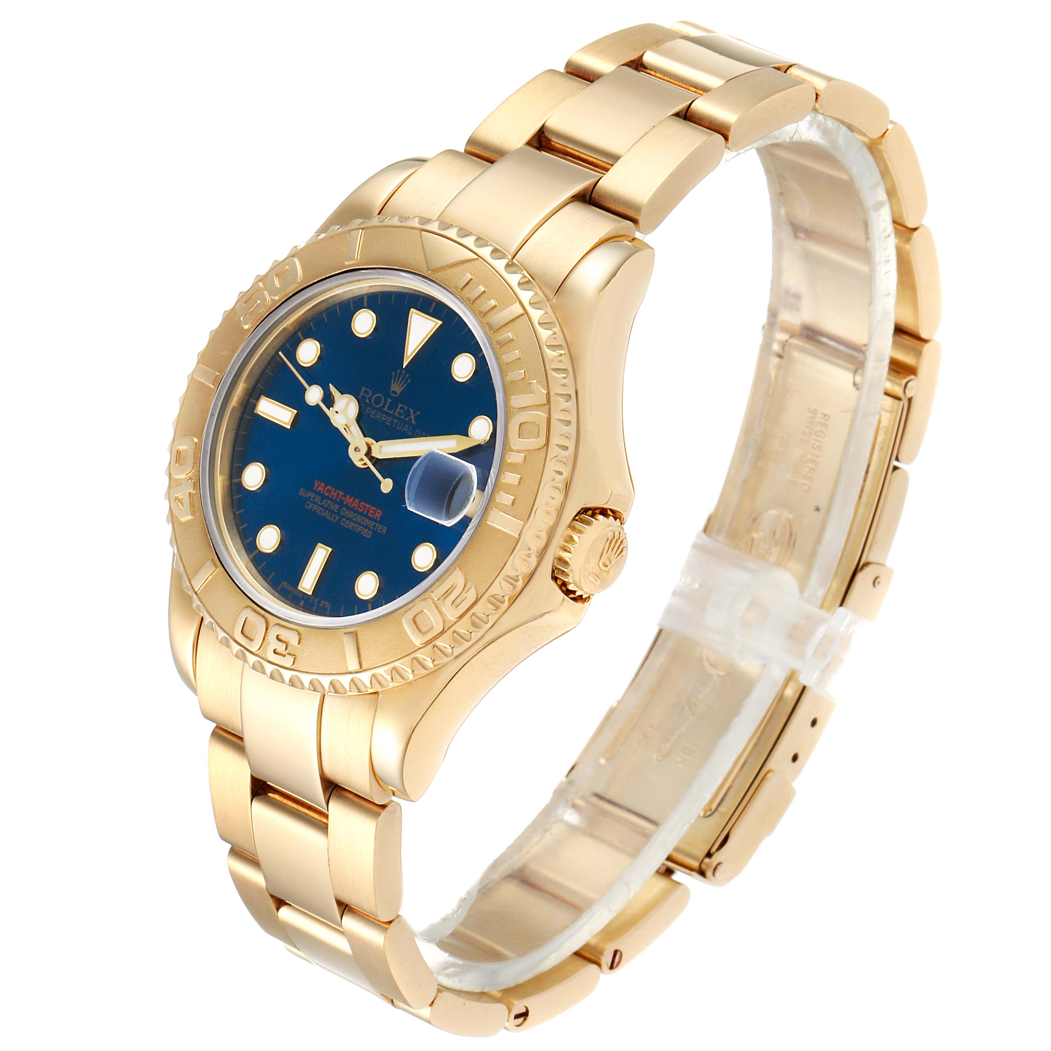 This image shows a Rolex Yacht-Master 68628 Men
s Yellow Gold Blue Dial 68628 Men
s Yellow Gold Blue Dial watch angled to display its gold bracelet, blue dial, bezel, and crown.