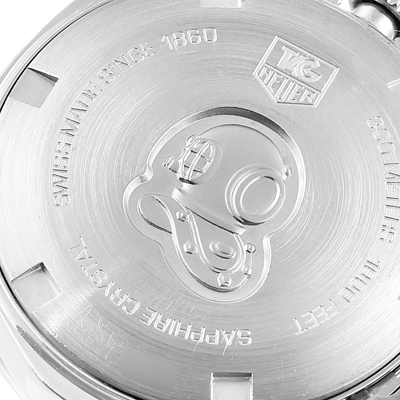 The image shows the back case of a Tag Heuer Aquaracer WAF1416.BA0824 Women
s Stainless Steel Mother of Pearl Dial WAF1416.BA0824 Women
s Stainless Steel Mother of Pearl Dial watch, featuring engraved details and branding.