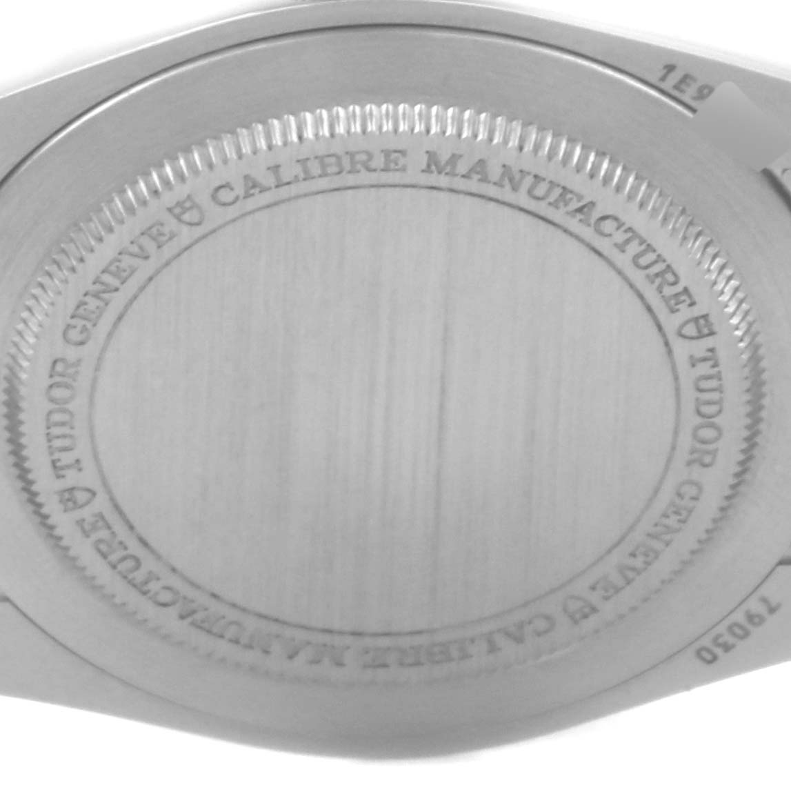 The image shows the case back of the Tudor Heritage Black Bay 79030N Men's Stainless Steel Black Dial 79030N Men's Stainless Steel Black Dial watch, highlighting its engravings.