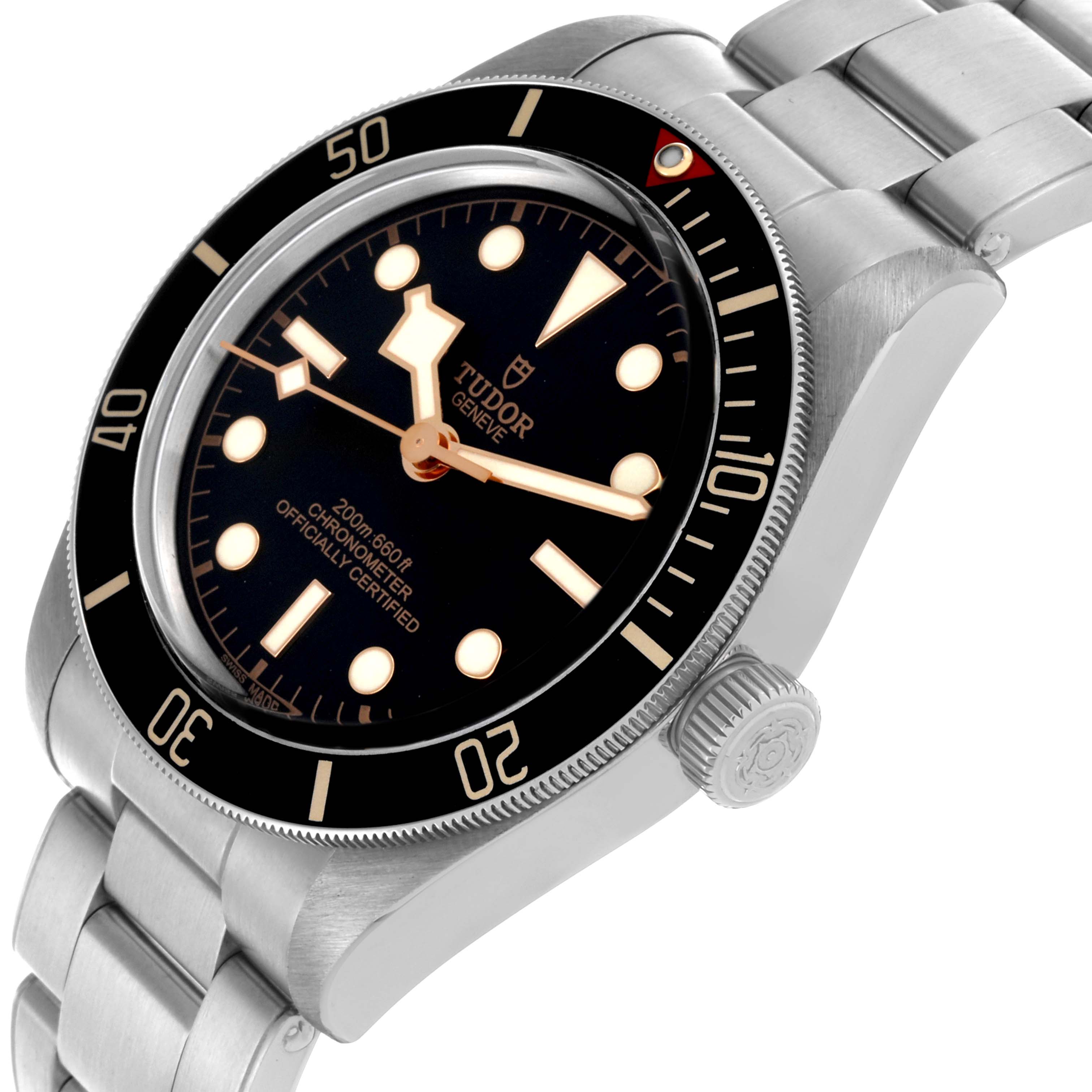 The Tudor Heritage Black Bay 79030N Men's Stainless Steel Black Dial 79030N Men's Stainless Steel Black Dial watch is shown at an angle displaying the dial, bezel, crown, and bracelet.
