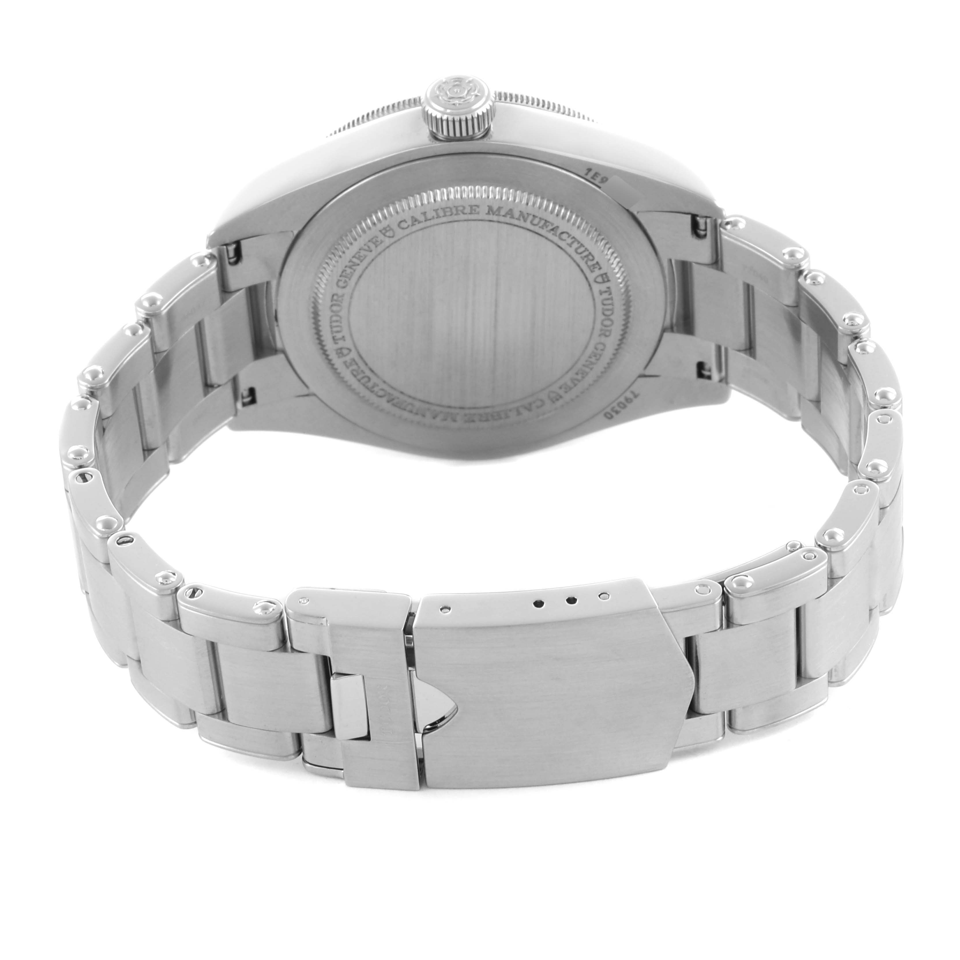 The image shows the back view of a Tudor Heritage Black Bay 79030N Men's Stainless Steel Black Dial 79030N Men's Stainless Steel Black Dial watch with its stainless steel bracelet and clasp.