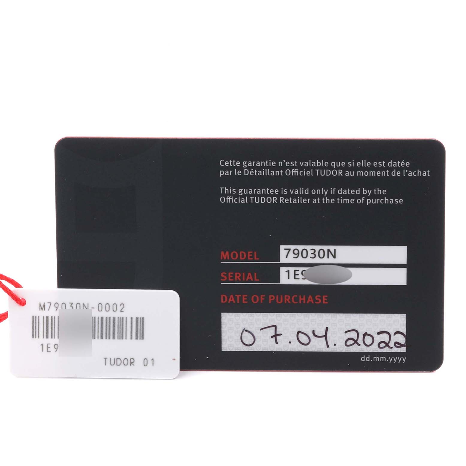 The image shows a warranty card for the Tudor Heritage Black Bay 79030N Men's Stainless Steel Black Dial 79030N Men's Stainless Steel Black Dial, displaying model, serial, and purchase date.