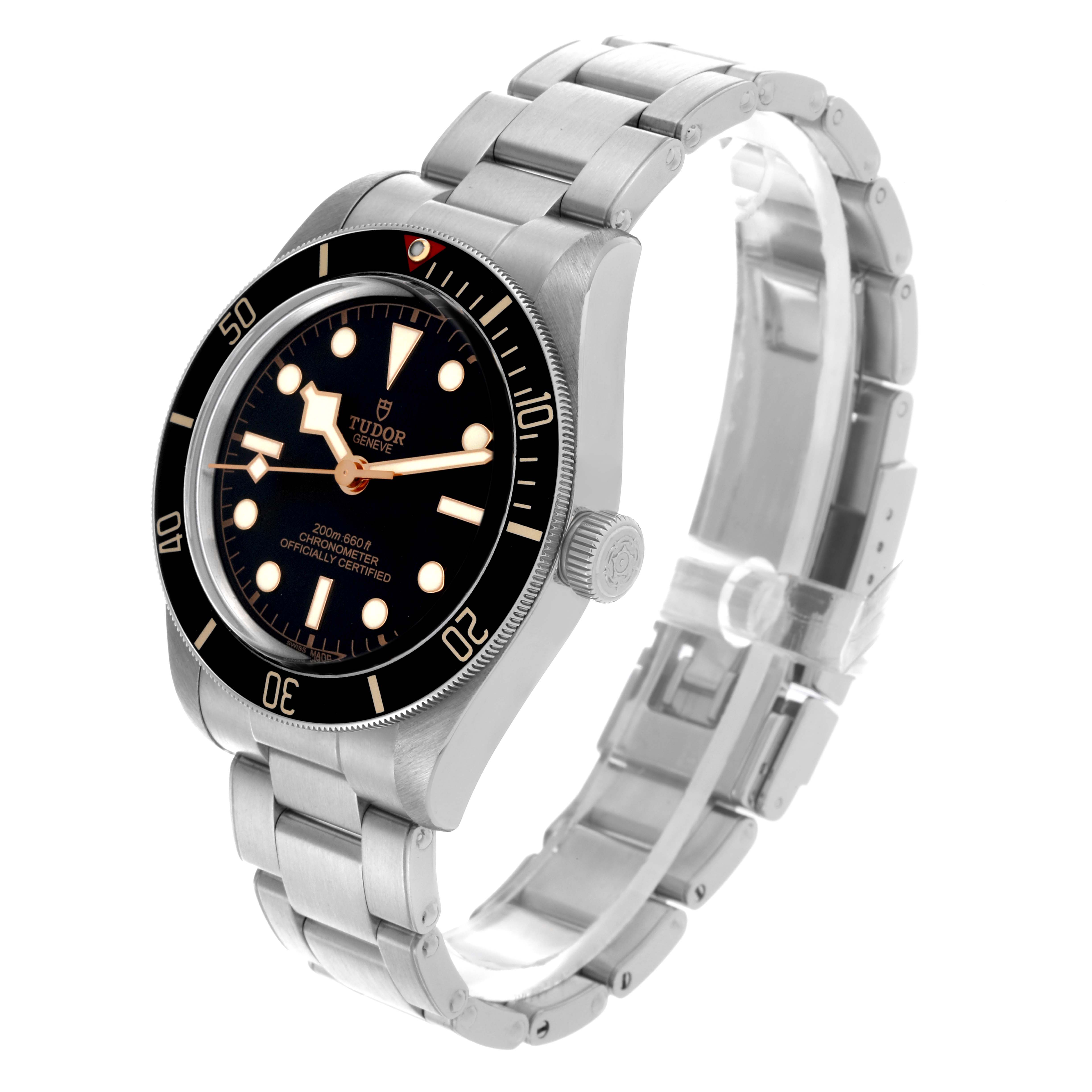 The Tudor Heritage Black Bay 79030N Men's Stainless Steel Black Dial 79030N Men's Stainless Steel Black Dial watch is shown at an angled perspective, highlighting the dial, bezel, bracelet, and crown.