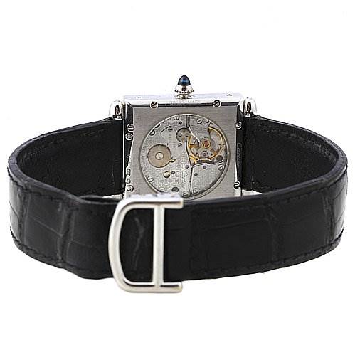 The image shows the back view of the Cartier Tank Obus 2380 White Gold Silver Dial 2380 White Gold Silver Dial watch, revealing its inner mechanics, with a black leather strap and metal buckle.