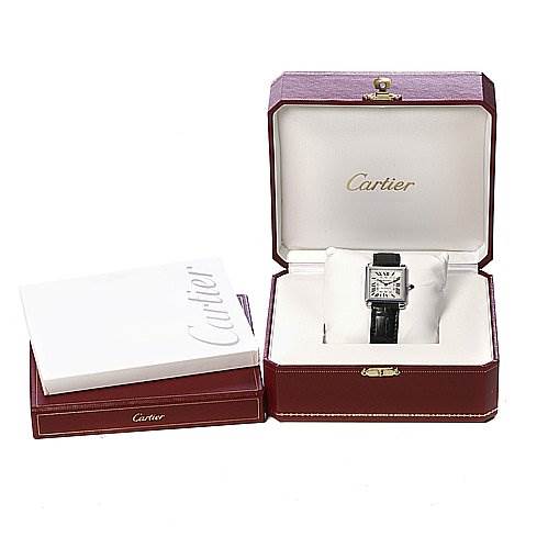 The image shows a Cartier Tank Obus 2380 White Gold Silver Dial 2380 White Gold Silver Dial watch placed in an open box, with an additional box and booklet beside it.