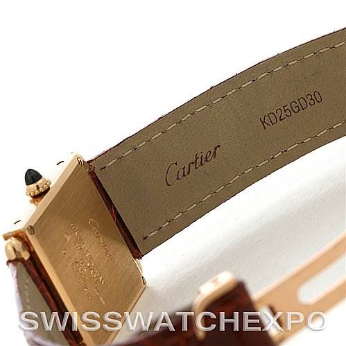 The image shows a close-up angle of the gold buckle and leather strap interior of the Cartier Tank Obus Yellow Gold Silver Dial Yellow Gold Silver Dial watch.