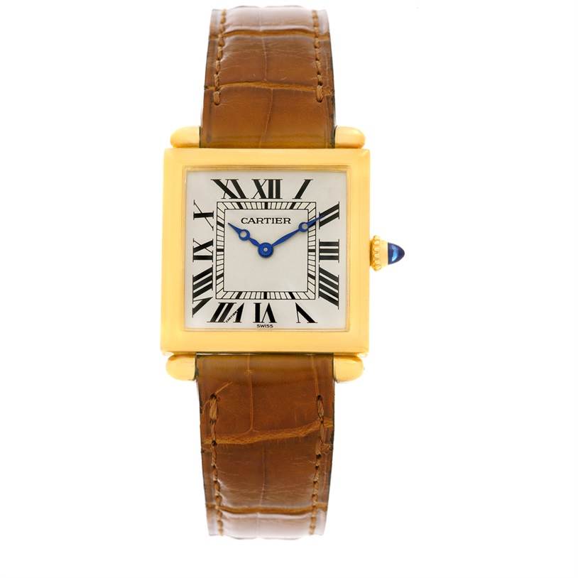 The image shows a front view of the Cartier Tank Obus W1512256 Yellow Gold Silver Dial W1512256 Yellow Gold Silver Dial watch featuring its square dial, Roman numerals, blue hands, and brown leather strap.