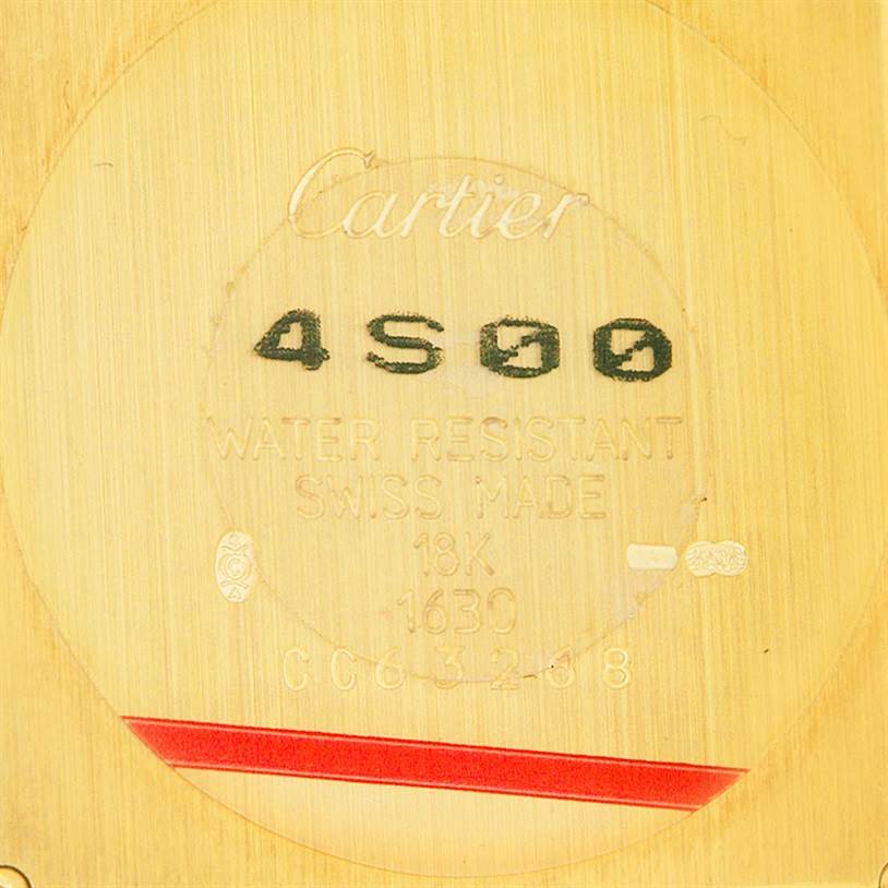 This image shows the engraved back case of a Tank Obus model watch by Cartier.