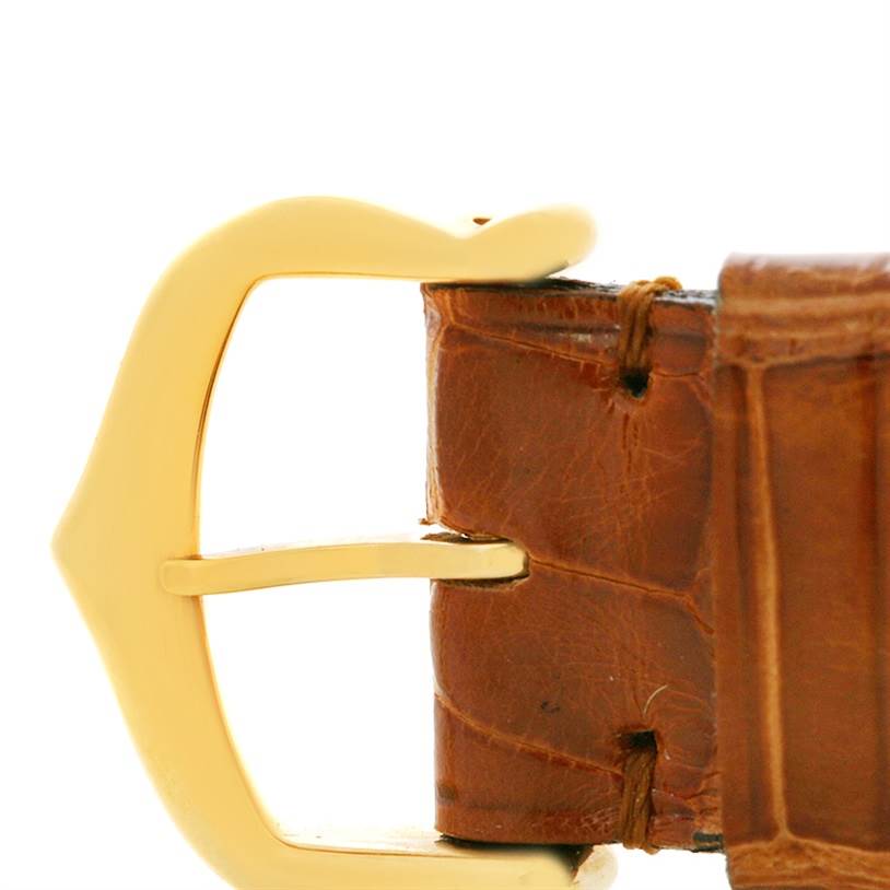 The image shows a close-up of the buckle and leather strap of the Cartier Tank Obus W1512256 Yellow Gold Silver Dial W1512256 Yellow Gold Silver Dial watch.