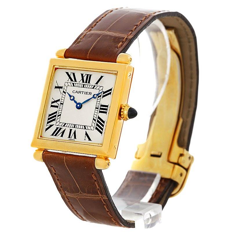 The image shows a Cartier Tank Obus Men's Yellow Gold Silver Dial Men's Yellow Gold Silver Dial watch at a three-quarter angle, highlighting the face, leather strap, and clasp.