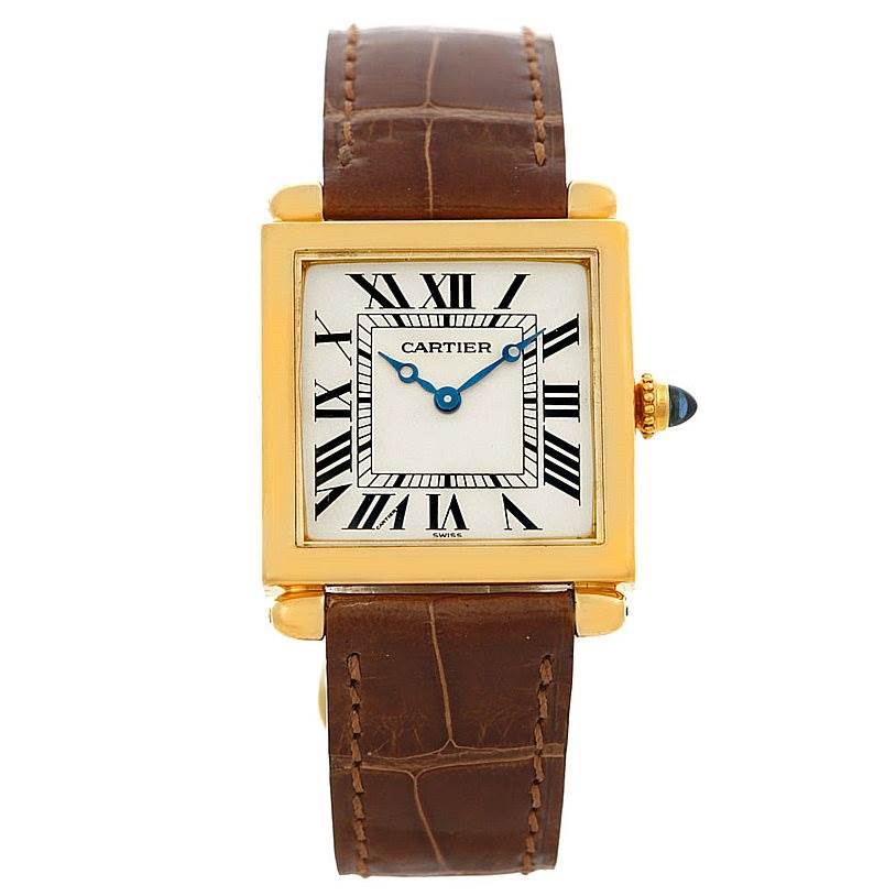The image shows a Cartier Tank Obus Men's Yellow Gold Silver Dial Men's Yellow Gold Silver Dial watch from a front view, highlighting its face, Roman numerals, and brown leather strap.
