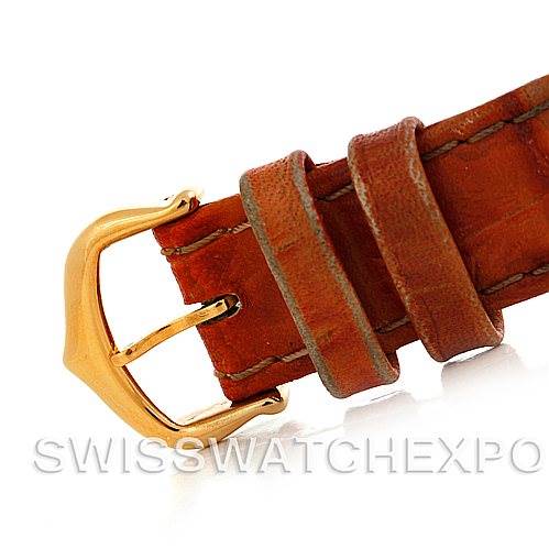 This image shows a close-up of the buckle and leather strap of the Cartier Tank Obus Men
s Yellow Gold Silver Dial Men
s Yellow Gold Silver Dial watch.
