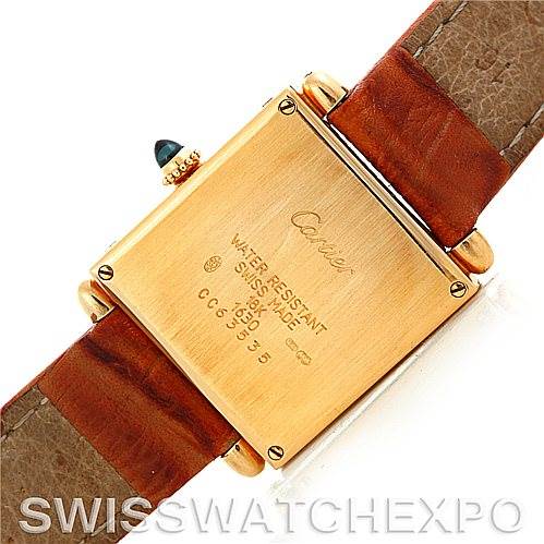 The image shows the back view of the Cartier Tank Obus Men
s Yellow Gold Silver Dial Men
s Yellow Gold Silver Dial watch, highlighting the case back and brown leather straps.