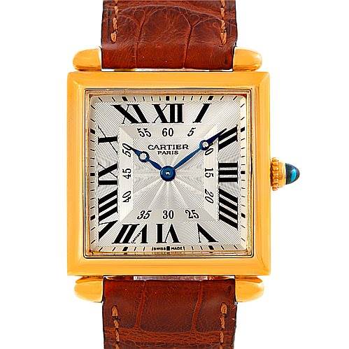 The image shows a front view of a Cartier Tank Obus W1527551 Men's Yellow Gold Silver Dial W1527551 Men's Yellow Gold Silver Dial watch, featuring its dial, case, and strap.