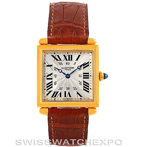 This image shows a front-facing view of a Cartier Tank Obus W1527551 Men's Yellow Gold Silver Dial W1527551 Men's Yellow Gold Silver Dial watch, highlighting its square dial and brown leather strap.