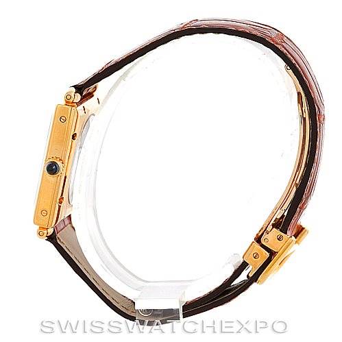 The image shows a side profile of the Cartier Tank Obus W1527551 Men's Yellow Gold Silver Dial W1527551 Men's Yellow Gold Silver Dial watch, highlighting the crown, case, and strap.