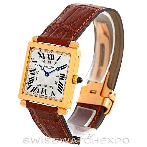 The image shows a Cartier Tank Obus W1527551 Men's Yellow Gold Silver Dial W1527551 Men's Yellow Gold Silver Dial watch at an angle displaying its face, gold case, and brown leather strap.