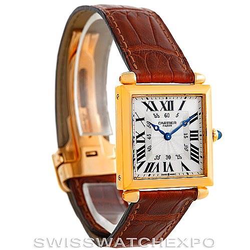 The image shows a Cartier Tank Obus W1527551 Men's Yellow Gold Silver Dial W1527551 Men's Yellow Gold Silver Dial watch at a slight front angle, displaying its gold case, brown strap, and white dial with Roman numerals.