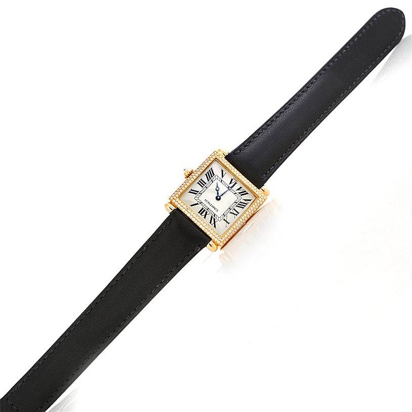 The image shows a top view of a Cartier Tank Obus W1512256 Men's Yellow Gold Silver Dial W1512256 Men's Yellow Gold Silver Dial watch with a square face and black leather strap.