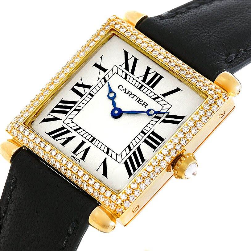 The image shows a front angle of a Cartier Tank Obus W1512256 Men's Yellow Gold Silver Dial W1512256 Men's Yellow Gold Silver Dial watch with a diamond-encrusted bezel and a black leather strap.