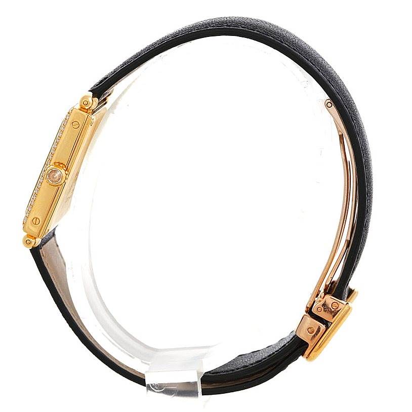 The image shows a side profile of the Cartier Tank Obus W1512256 Men's Yellow Gold Silver Dial W1512256 Men's Yellow Gold Silver Dial watch, highlighting its gold case and black strap.