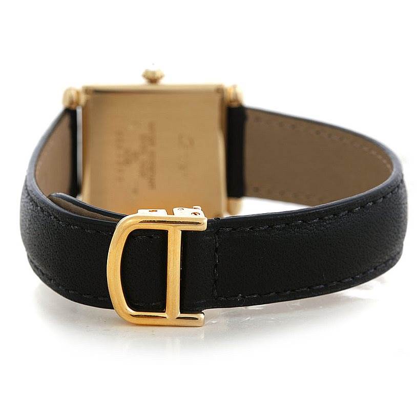 The image shows the back of a Cartier Tank Obus W1512256 Men's Yellow Gold Silver Dial W1512256 Men's Yellow Gold Silver Dial watch, highlighting the leather strap and gold buckle.