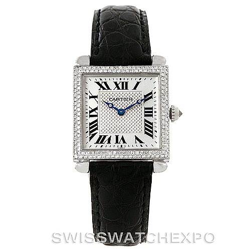 This image shows a Cartier Tank Obus Men's White Gold Silver Dial Men's White Gold Silver Dial watch from a front angle, highlighting its square face, Roman numerals, and black leather strap.