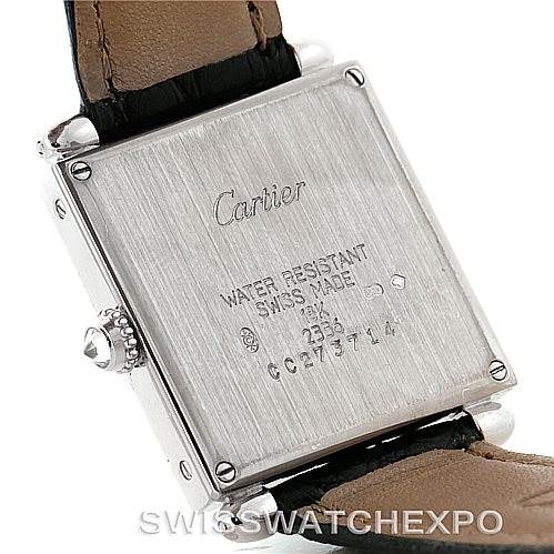 The image shows the back case and part of the leather strap of a Cartier Tank Obus Men's White Gold Silver Dial Men's White Gold Silver Dial watch.