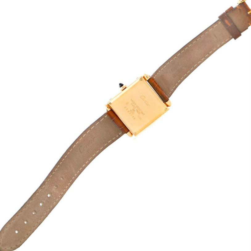 The image shows the back of the Cartier Tank Obus 1630 Men's Yellow Gold Silver Dial 1630 Men's Yellow Gold Silver Dial watch, including the case back and full leather strap.