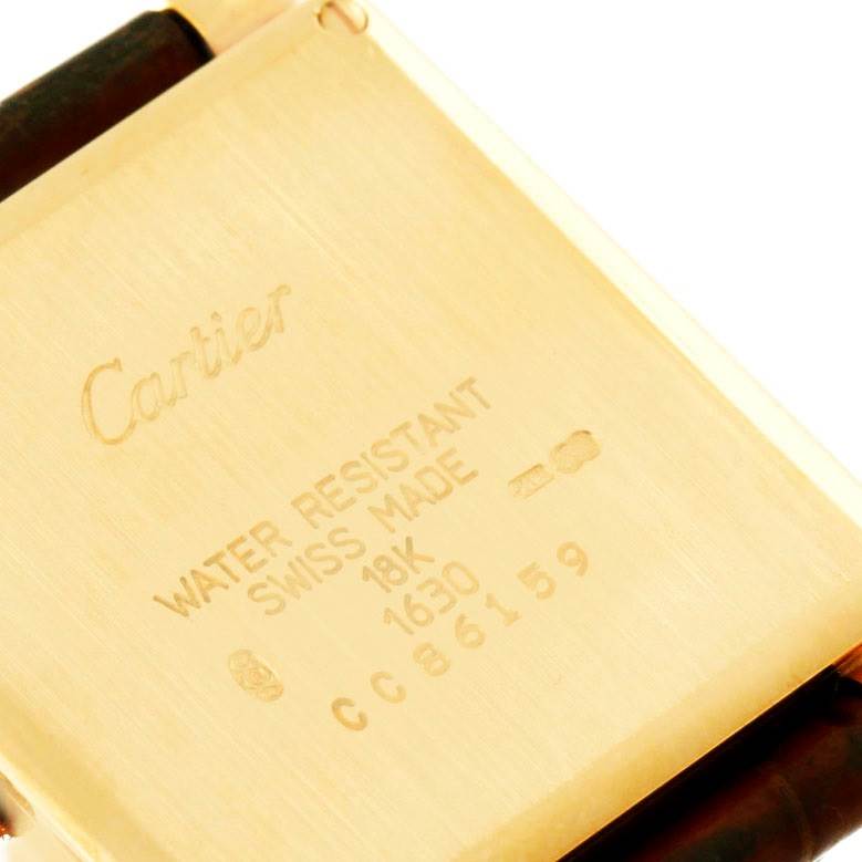 The image shows the back case of a Tank Obus watch by Cartier.