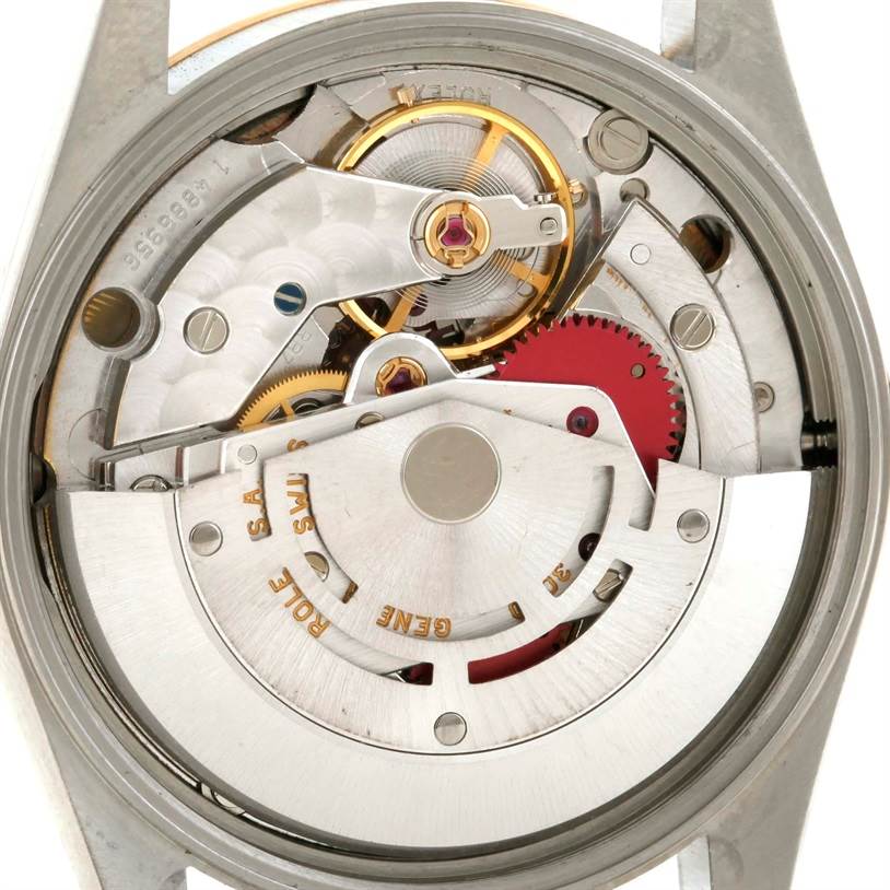 This image shows the internal mechanism of a Rolex Oyster Perpetual 14233 Men's Steel and Gold (two tone) Grey Dial 14233 Men's Steel and Gold (two tone) Grey Dial watch from a top-down angle.