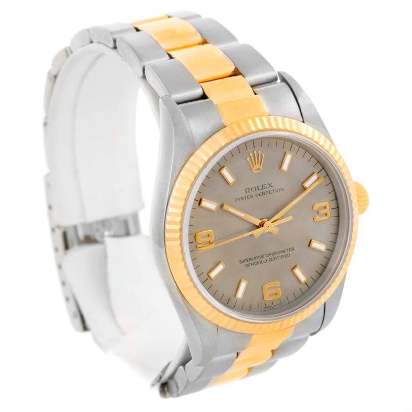 This image shows a Rolex Oyster Perpetual 14233 Men's Steel and Gold (two tone) Grey Dial 14233 Men's Steel and Gold (two tone) Grey Dial watch from a right-side angle, highlighting its dial, bezel, and two-tone bracelet.