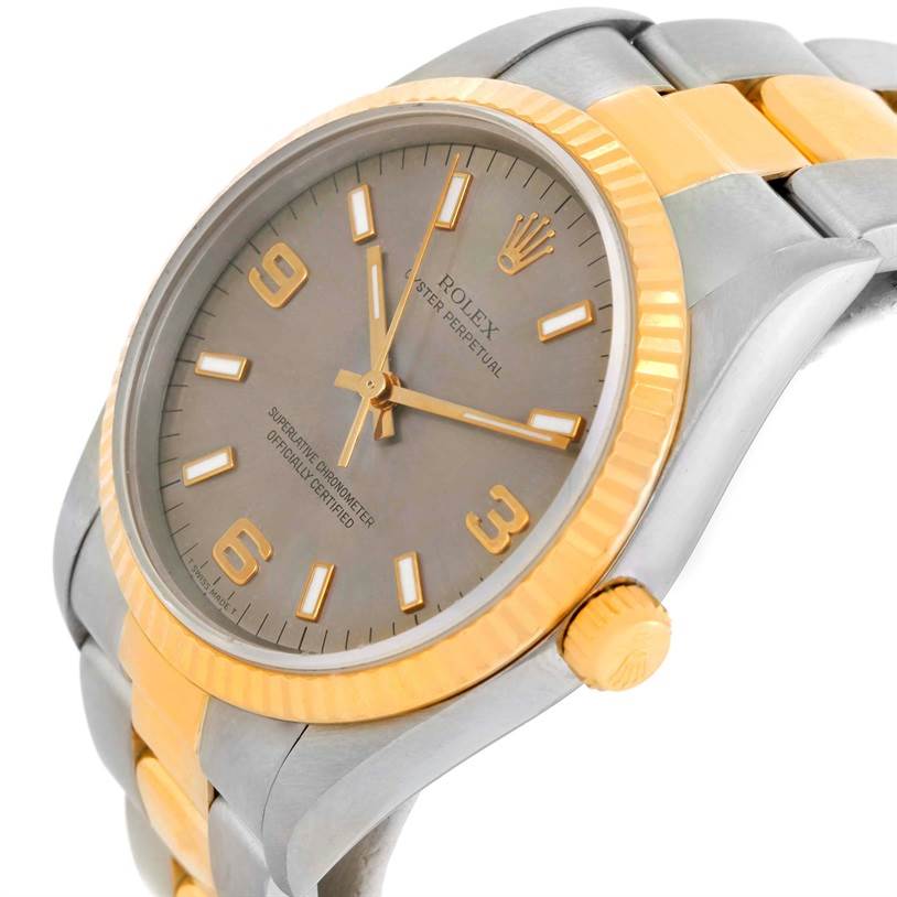The image shows a partial side view of a Rolex Oyster Perpetual 14233 Men's Steel and Gold (two tone) Grey Dial 14233 Men's Steel and Gold (two tone) Grey Dial watch, highlighting the dial, bezel, and bracelet.