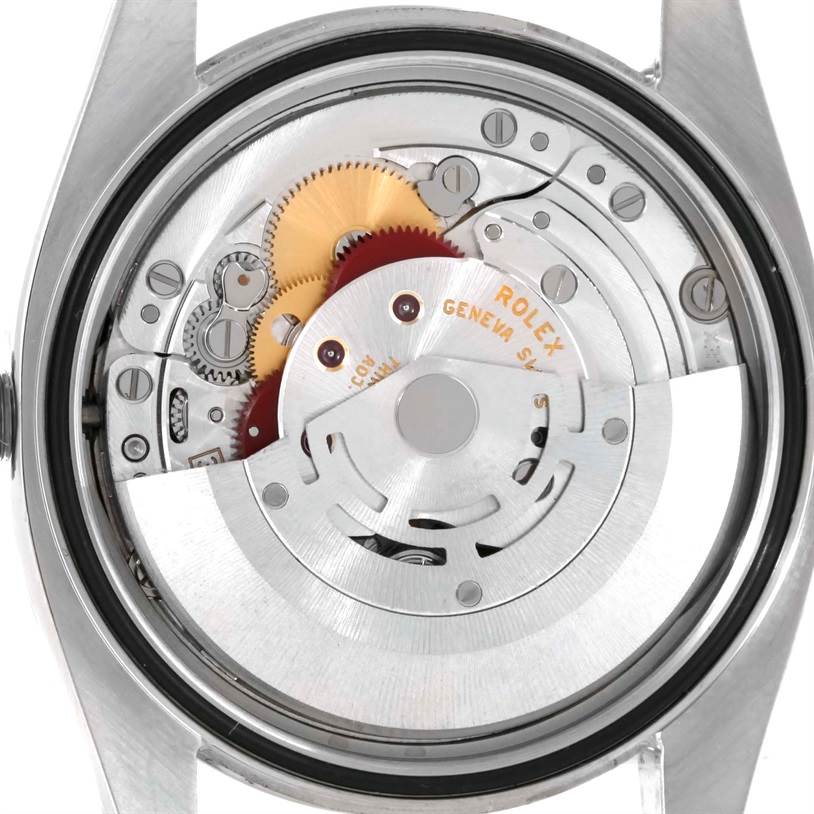 The image shows the inner mechanism of a Rolex Oyster Perpetual 116000 Men's Black Dial 116000 Men's Black Dial watch from a rear angle.