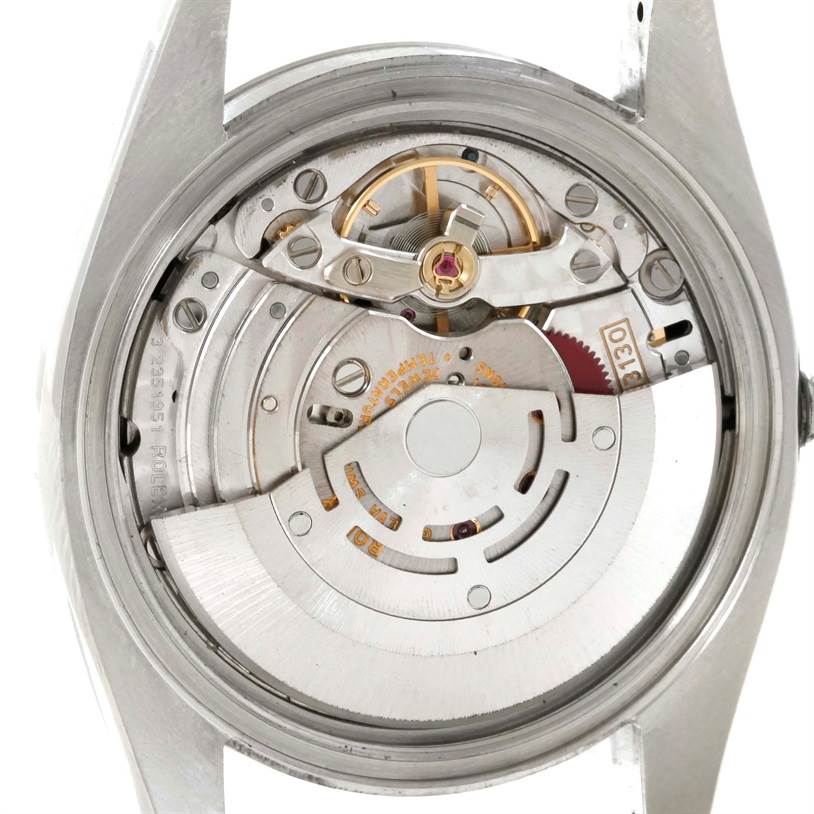 This image shows the internal movement components of a Rolex Oyster Perpetual 116000 Men
s Stainless Steel Black Dial 116000 Men
s Stainless Steel Black Dial watch viewed from the back case.