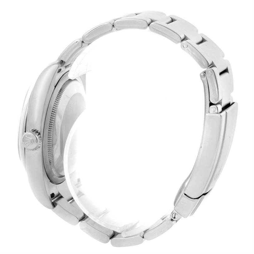 Side view of a Rolex Oyster Perpetual 116000 Men
s Stainless Steel Black Dial 116000 Men
s Stainless Steel Black Dial watch showing the bracelet and crown.