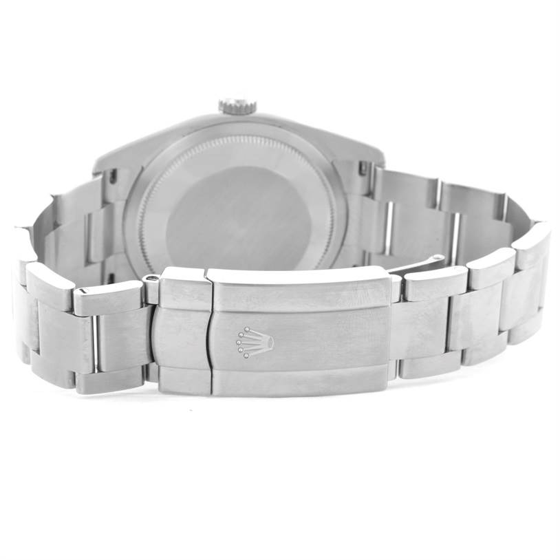 This image shows the case back and clasp of a Rolex Oyster Perpetual 116000 Men's Stainless Steel Black Dial 116000 Men's Stainless Steel Black Dial watch, viewed from the rear.