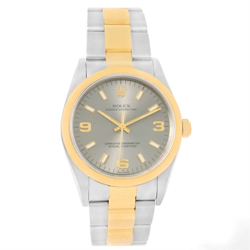 The image shows a front view of a Rolex Oyster Perpetual 14203 Men's Steel and Gold (two tone) Grey Dial 14203 Men's Steel and Gold (two tone) Grey Dial watch, highlighting its gold and silver band, bezel, and dial.