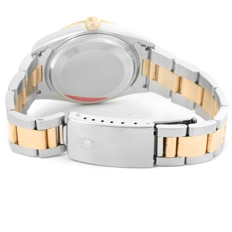 The image shows the back and bracelet of a Rolex Oyster Perpetual 14203 Men's Steel and Gold (two tone) Grey Dial 14203 Men's Steel and Gold (two tone) Grey Dial watch with a two-tone metal design.