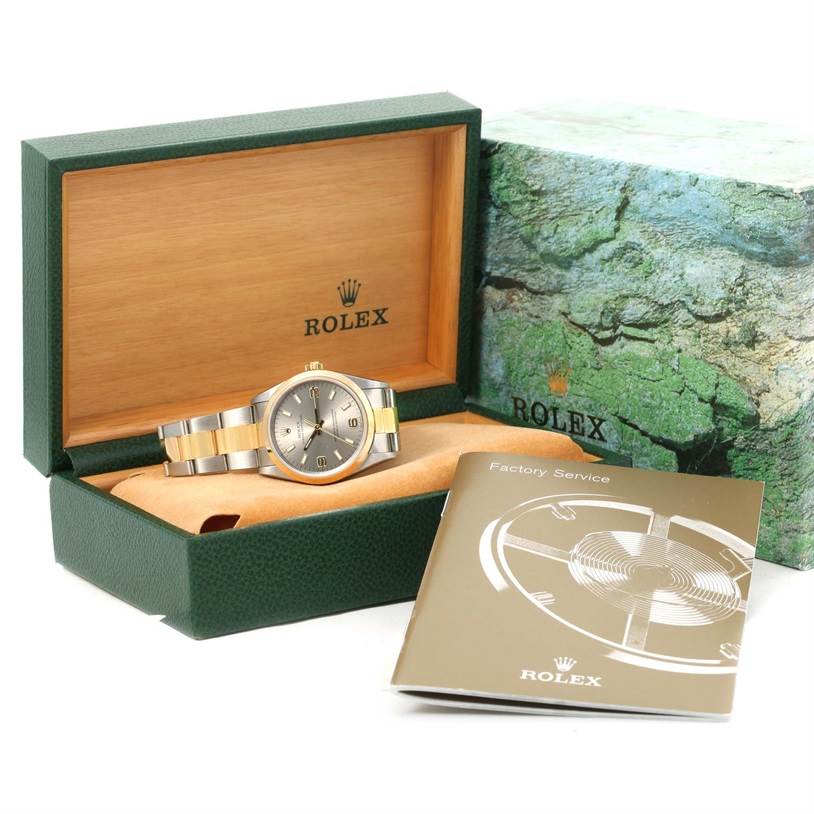 The image shows a Rolex Oyster Perpetual 14203 Men's Steel and Gold (two tone) Grey Dial 14203 Men's Steel and Gold (two tone) Grey Dial watch in its green box, alongside a Rolex Factory Service booklet.