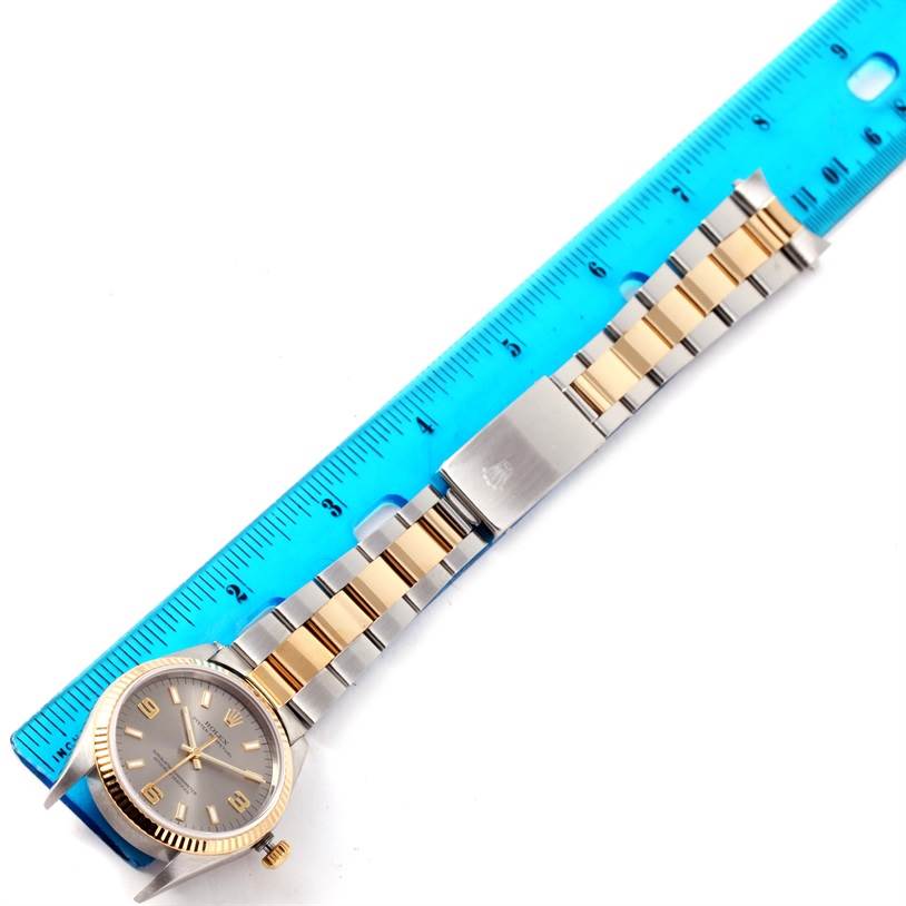 The image shows a Rolex Oyster Perpetual 14233 Men's Steel and Gold (two tone) Grey Dial 14233 Men's Steel and Gold (two tone) Grey Dial watch laid flat with its bracelet and clasp visible, positioned along a ruler for measurement.