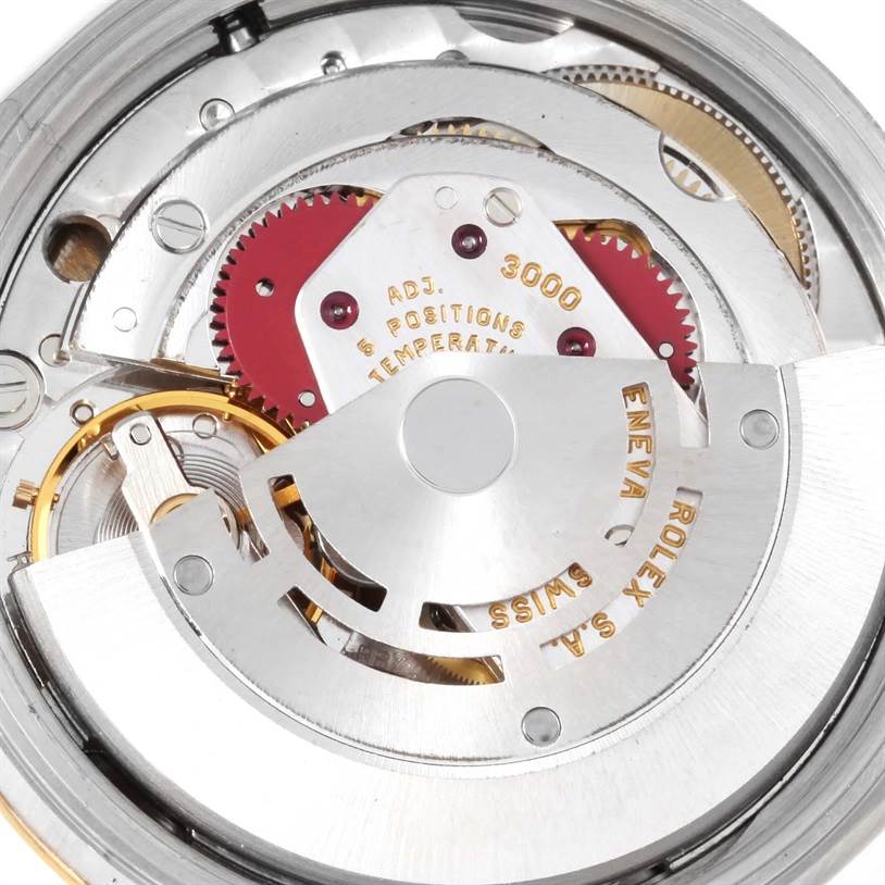 This image shows a close-up view of the inner mechanical movement of the Rolex Oyster Perpetual 14233 Men's Steel and Gold (two tone) Grey Dial 14233 Men's Steel and Gold (two tone) Grey Dial watch.