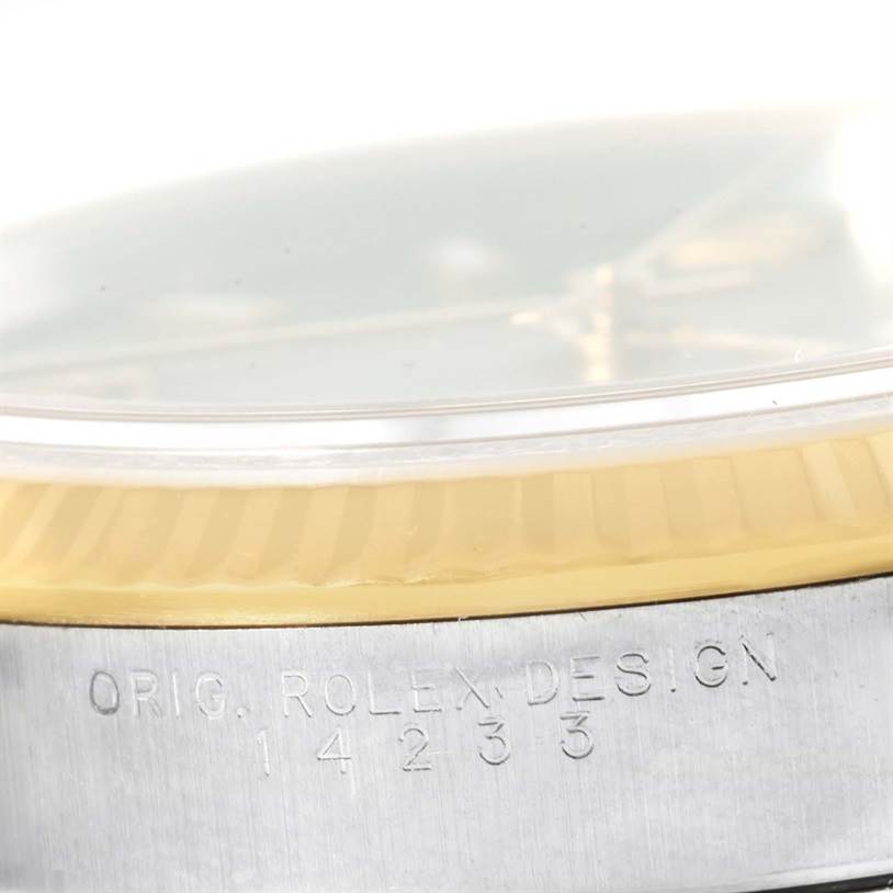 The image shows a close-up of the side of a Rolex Oyster Perpetual 14233 Men's Steel and Gold (two tone) Grey Dial 14233 Men's Steel and Gold (two tone) Grey Dial watch, highlighting the bezel and model engraving.