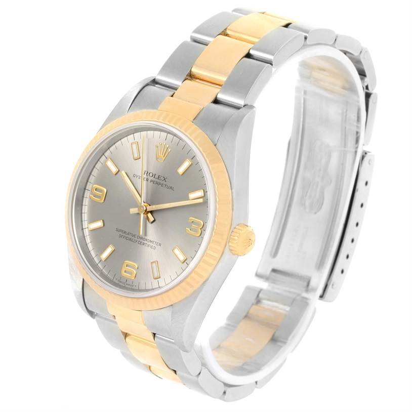 The image shows a Rolex Oyster Perpetual 14233 Men's Steel and Gold (two tone) Grey Dial 14233 Men's Steel and Gold (two tone) Grey Dial watch at a three-quarter angle, highlighting its silver and gold bracelet and watch face.