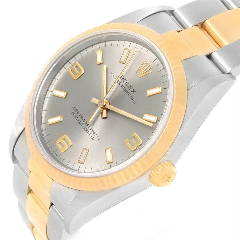 The Rolex Oyster Perpetual 14233 Men's Steel and Gold (two tone) Grey Dial 14233 Men's Steel and Gold (two tone) Grey Dial watch is shown at a slight angle, displaying its face, bezel, case, crown, and part of the bracelet.