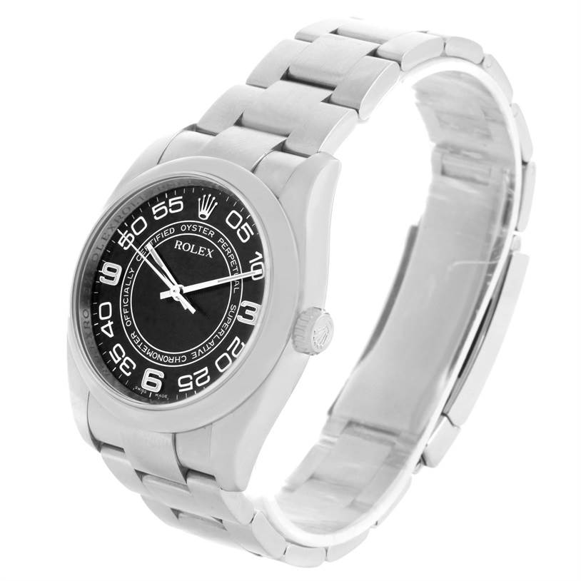 The Rolex Oyster Perpetual 116000 Men's Stainless Steel Black Dial 116000 Men's Stainless Steel Black Dial watch is shown at a slight angle, displaying the face, bezel, crown, and bracelet.